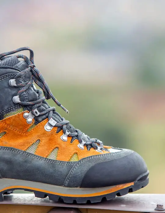A-leather-trekking-hiking-winter-boot-on-blurred-background