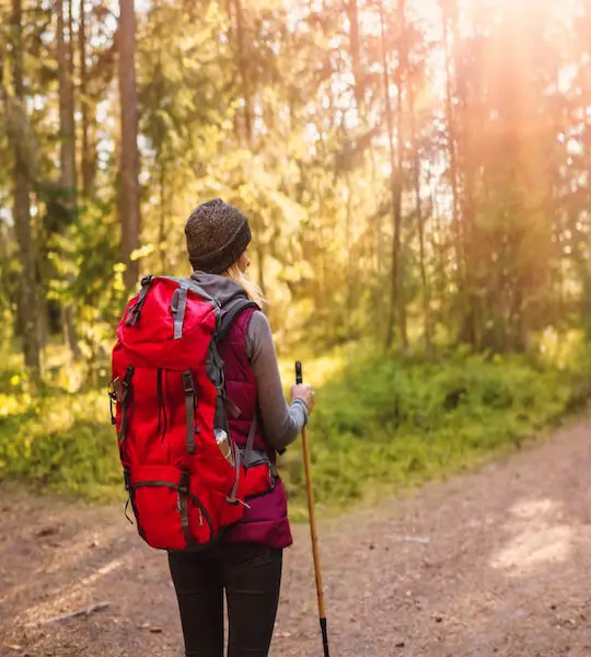 Woman-hiking-and-going-camping-in-nature.-Concept-of-choosing-lost-while-camping