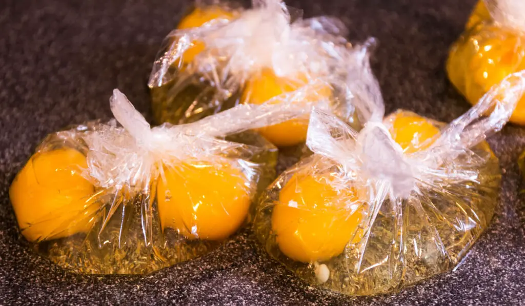 precracked eggs, egg yolks in plastic bags 