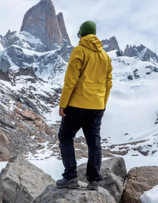 A-hiker-with-a-yellow-jacket-on-the-base-of-Fitz-Roy-Mountain-in-Patagonia-Argentina