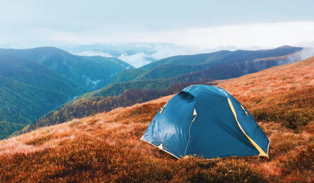 Tent on autumn mountains
